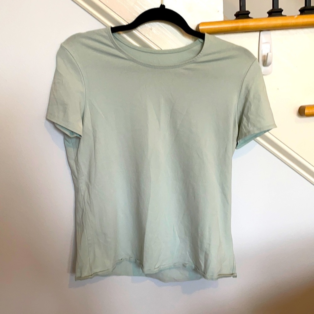 Short sleeved teal shirt